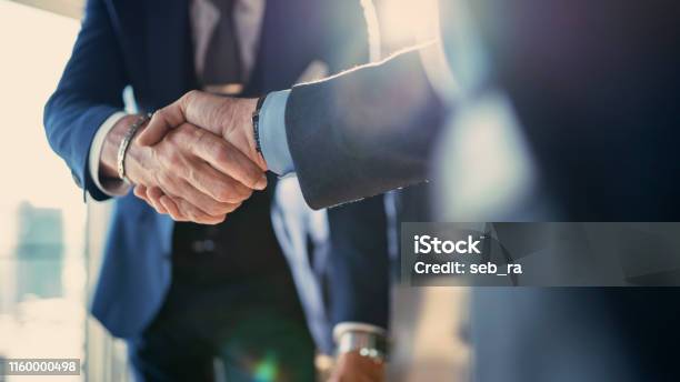 Business Partnership Meeting In Office Stock Photo - Download Image Now - Handshake, Business, Partnership - Teamwork