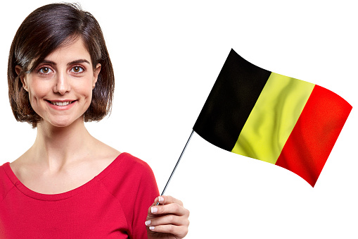 Young Woman Is Holding Belgian Flag On White Background