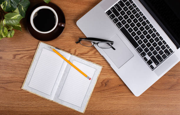 istock Home Office Desk With Notebook, Laptop and Coffee 1160000820