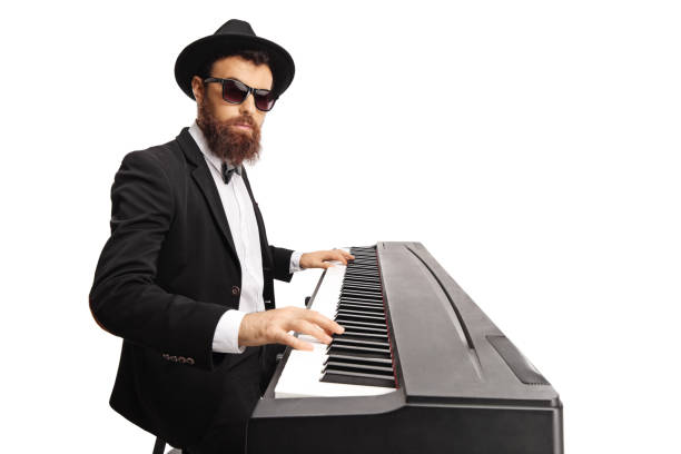 istock Bearded male musician playing a digital piano 1160002183