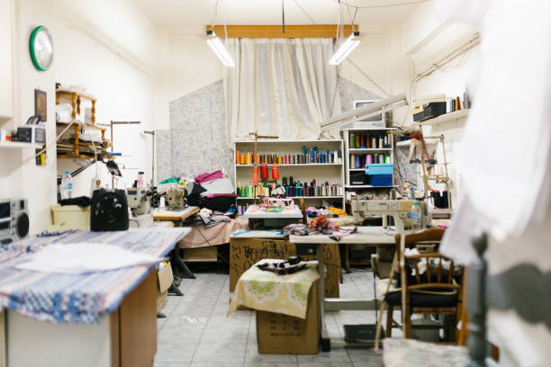 Empty room of family sewing and tailoring small business Photo series of a real greek family where grandmother runs small sewing business and teaches her granddaughter the ins and outs of the business. atelier fashion photos stock pictures, royalty-free photos & images