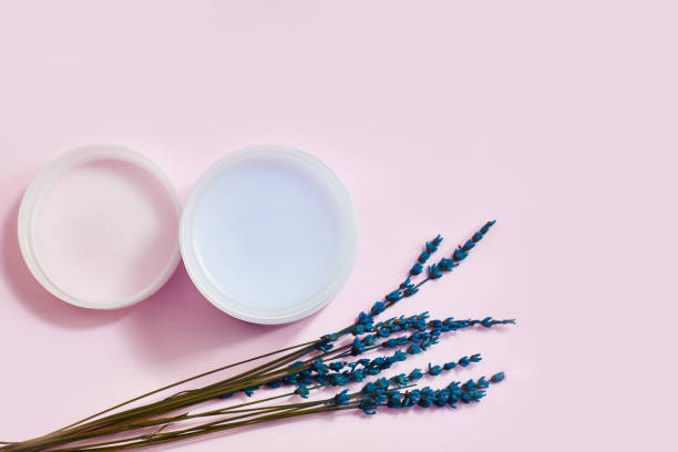 istock Lavender organic cosmetics on a pink background table top view. 1160003199