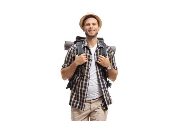 Cheerful male tourist with a backpack isolated on white background