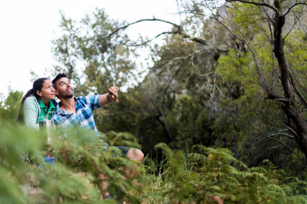 istock Couple having coffee spotting birds in nature 1160003818