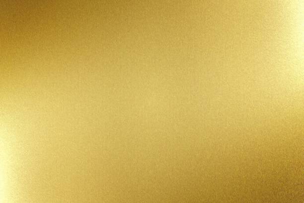 Light shining on gold metal board, abstract texture background Light shining on gold metal board, abstract texture background Foil stock pictures, royalty-free photos & images