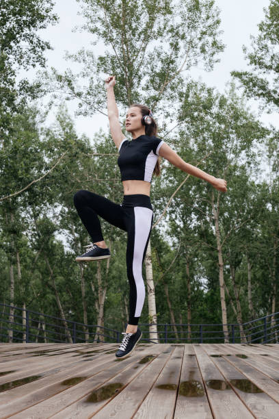 istock Young female athlete jumping 1160004930