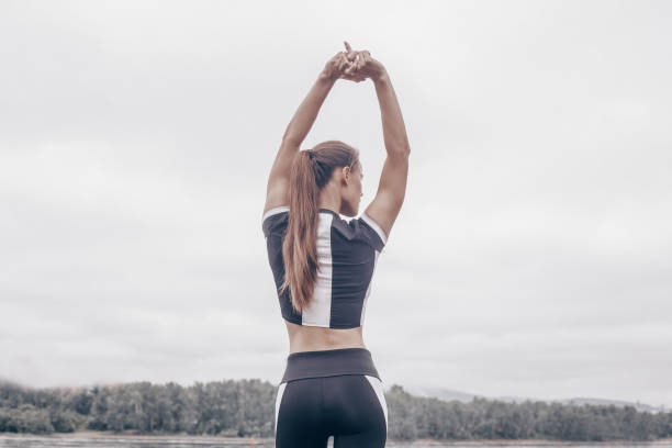 istock Young female athlete stretching 1160004989