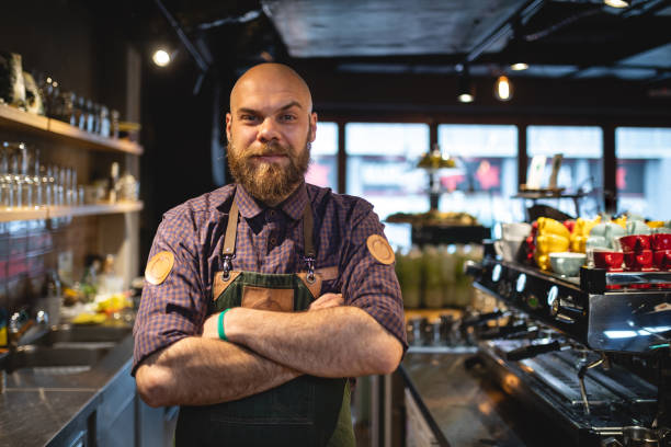 istock Muscular barista in his cafe 1160009098