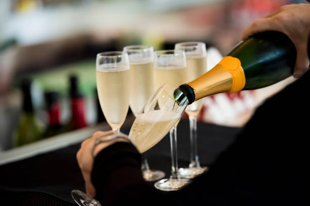 istock Waitress pouring champagne into the glass 1160009190