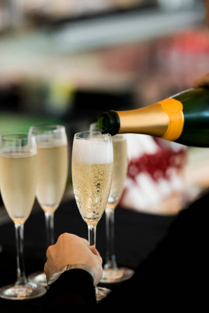 istock Pouring champagne into the glass 1160009265