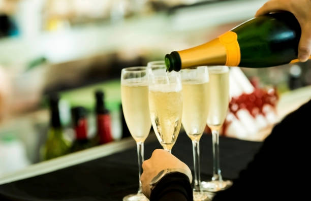 istock Bartender pouring champagne in the glass 1160009523