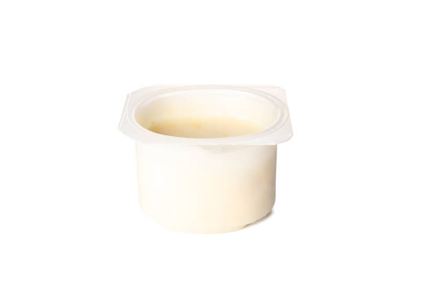 istock Plastic cup with cream yogurt isolated on white background, space for text 1160009591