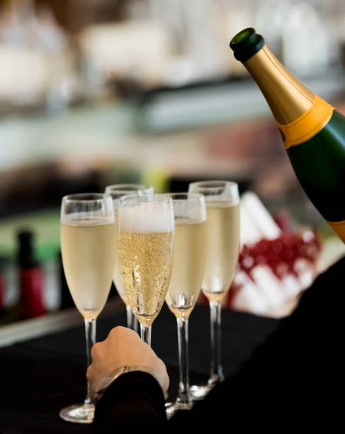 istock Bartender holding bottle of champagne 1160009619