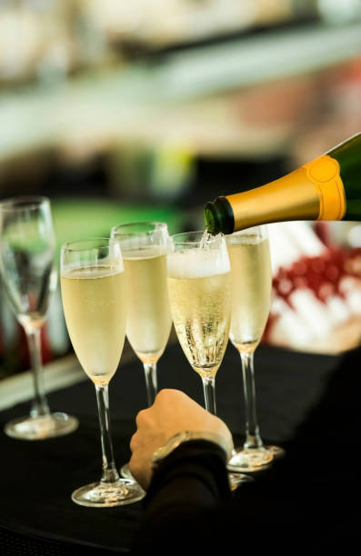 istock Bartender at the bar pouring champagne 1160010182