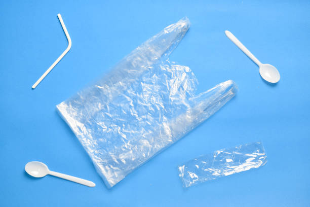 istock plastic bag on blue background. ocean plastic pollution concept. 1160012660