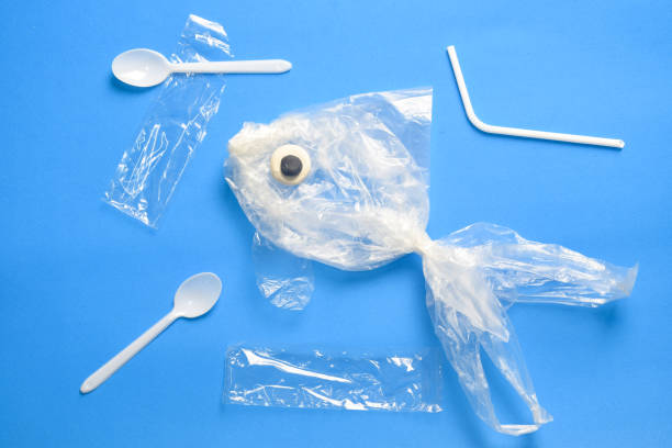 istock stop ocean plastic pollution and saving the environment concept. fish from a plastic bag. 1160012674