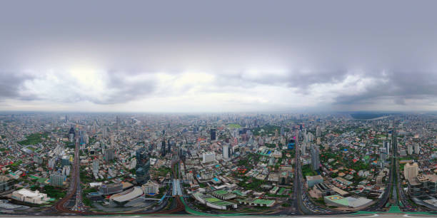 istock 360 panorama by 180 degrees angle seamless panorama view of Sathorn intersection or junction with cars traffic, Bangkok Downtown. Thailand. Financial district and business centers in smart urban city. 1160013368