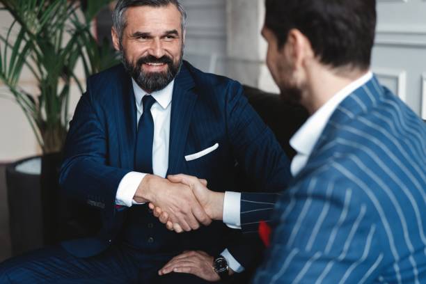 istock Business people shaking hands, finishing up a meeting. 1160013402