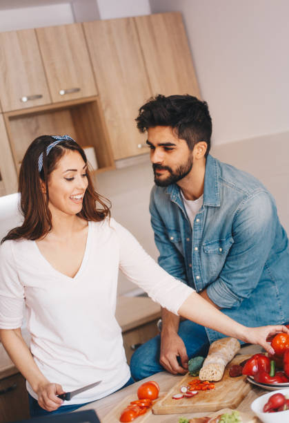 istock Lovely couple in the kitchen 1160013461