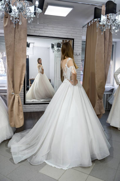 istock Young bride in charming wedding dress in boutique 1160013914