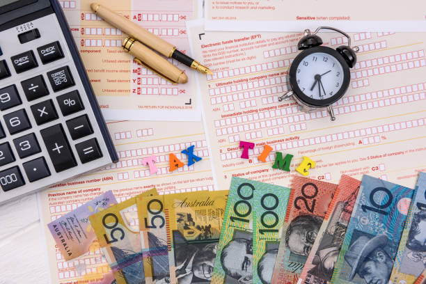 istock Australian dollars with calculator on tax declaration 1160014076