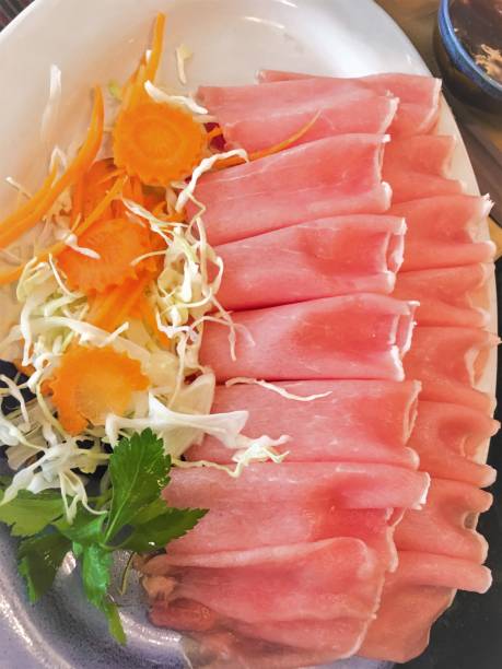 istock fresh  Thin sliced pork  for Shabu on dish. 1160015069