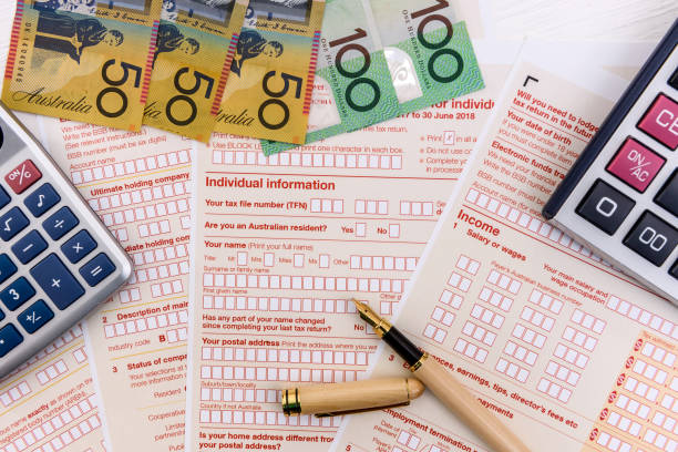 istock Australian tax declaration as background for calculator and dollars 1160015152