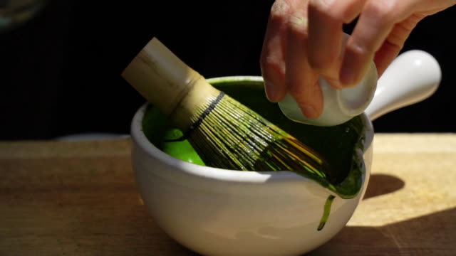 Green Tea Matcha with traditional bamboo whisk.