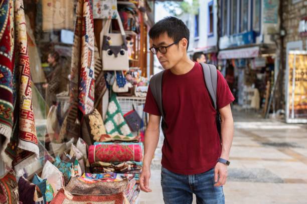 istock Traveler looking at trinkets 1160019341