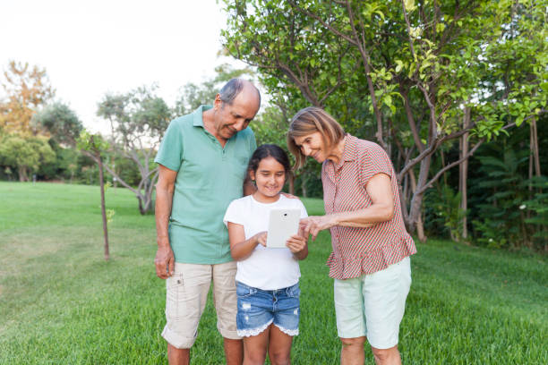 istock Grandparents and Granddaughter using tablet 1160020676