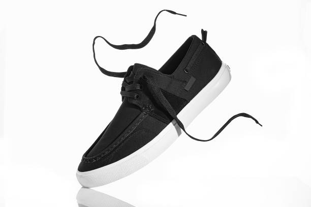 istock Black men's sneakers on a white background. 1160022898