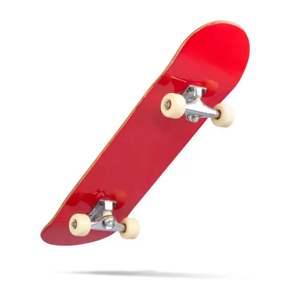 Photo of Red skateboard deck, isolated on white background. File contains a path to isolation