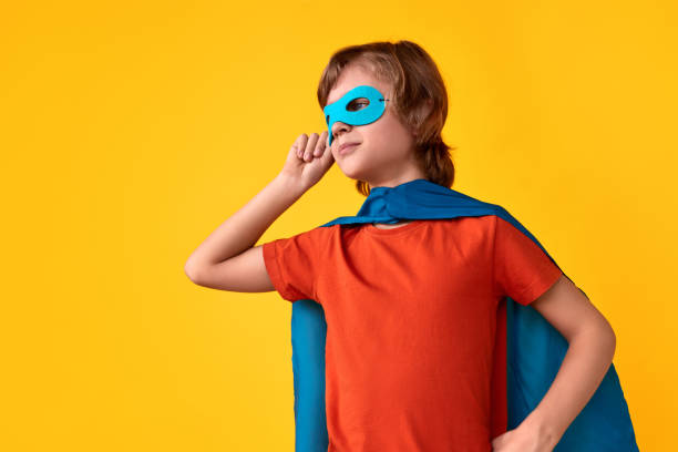 istock Little superhero adjusting mask 1160023883