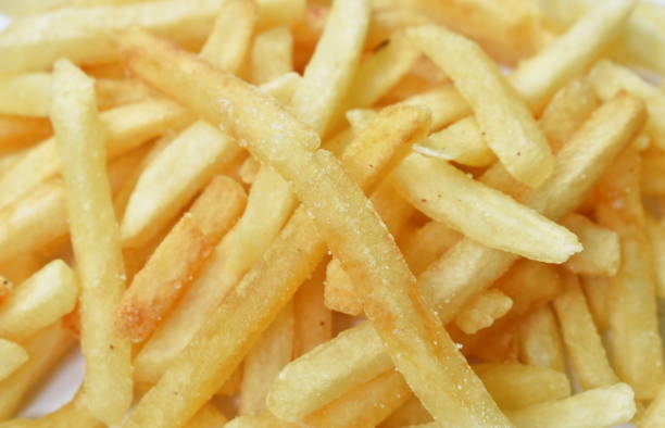 istock French fried mixed with salt arranging on white background 1160025161