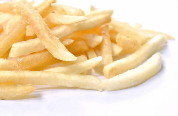 hand picking a single potato chip from a plate