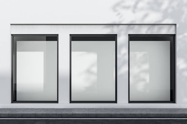 White building exterior with mock up posters Exterior of white building with three vertical mock up posters in windows. Concept of advertising and marketing. 3d rendering store window stock pictures, royalty-free photos & images