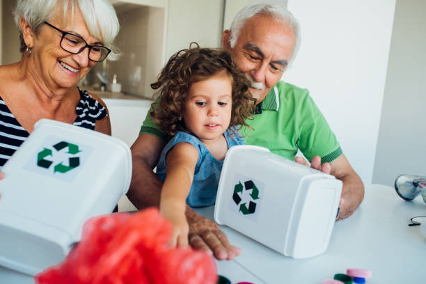 istock Grandparents teaching a child to recycle 1160027293