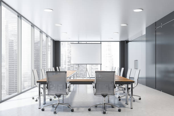 istock Black meeting room interior with projection screen 1160027303