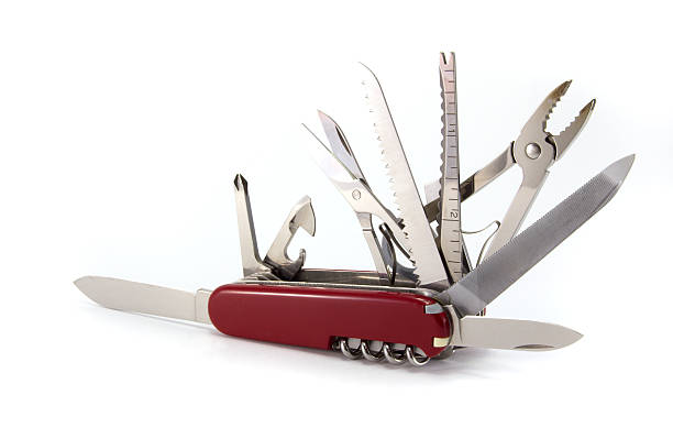 Maroon Swiss Army knife with blades extended A Swiss army knife, isolated on white. penknife stock pictures, royalty-free photos & images