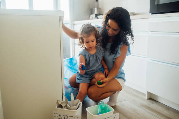 Mother and daughter recycling