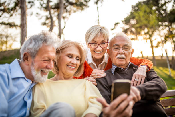 istock Group of seniors using mobile phone 1160028581