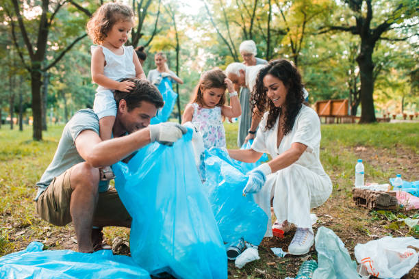 istock Cheerful family collecting trash 1160028971
