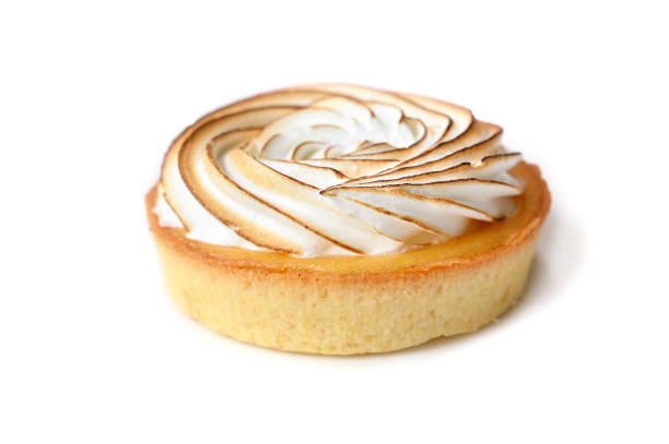istock Lemon meringue tart on white background 1160028989