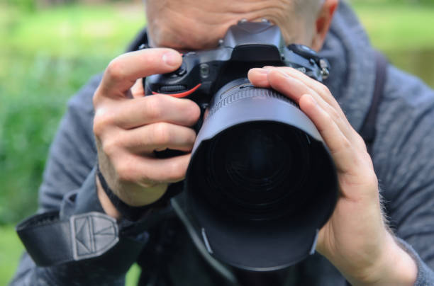 istock The photographer is photographing with the camera. 1160030404