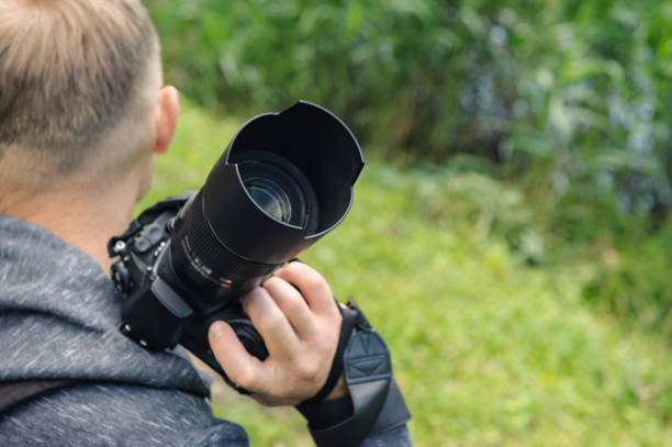 istock A photographer with the camera. 1160030409