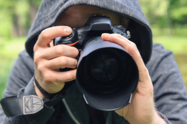 istock The photographer hidden with the camera. 1160030413