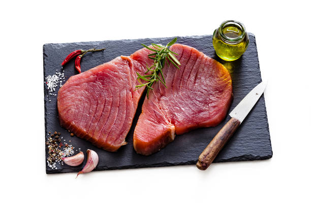 白い背景に隔離された2つの生のマグロステーキ - tuna tuna steak raw freshness ストックフォトと画像