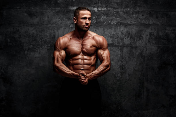 istock Power! Strong Muscular Men posing and Flexing Muscles 1160031949