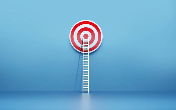 istock White Ladder Leaning on A Target on Blue Wall 1160035966