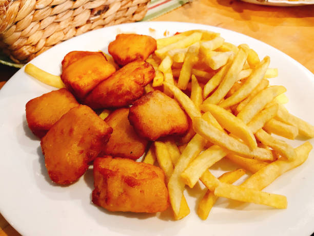 A dish of yummy Fish and potato chips.